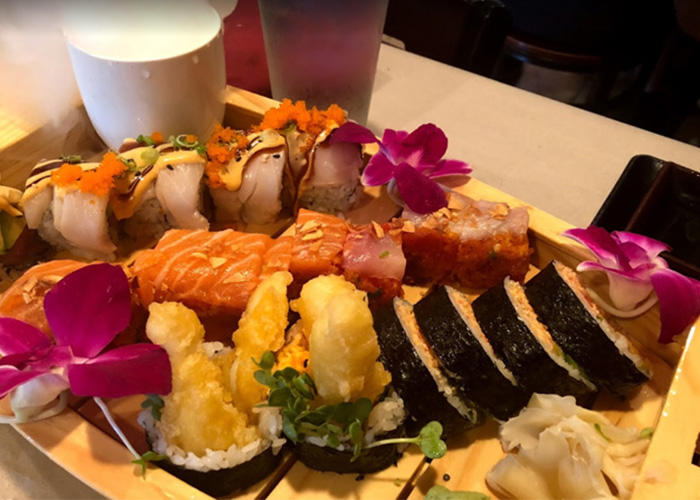 An assortment of sushi rolls and nigiri at Sushi Train